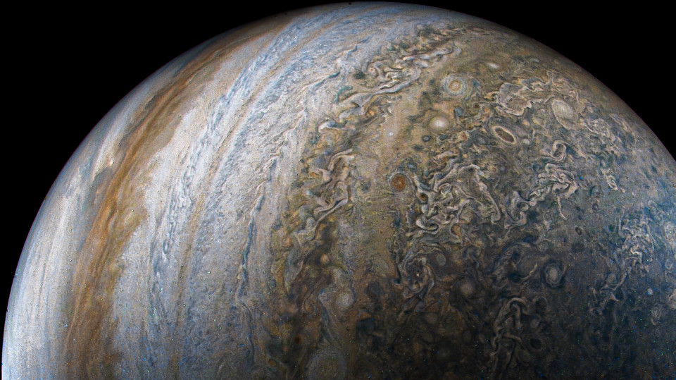 A wide banded hemisphere of Jupiter packed with vortices