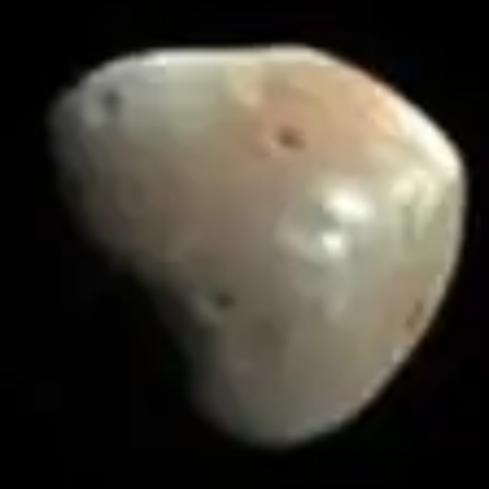 Deimos, a smooth pale wedge with a few shallow craters