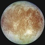 Europa: pale ice cut by rust-coloured cracks