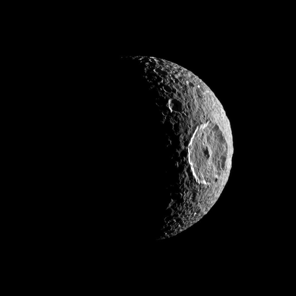 Mimas, its huge Herschel crater catching the light
