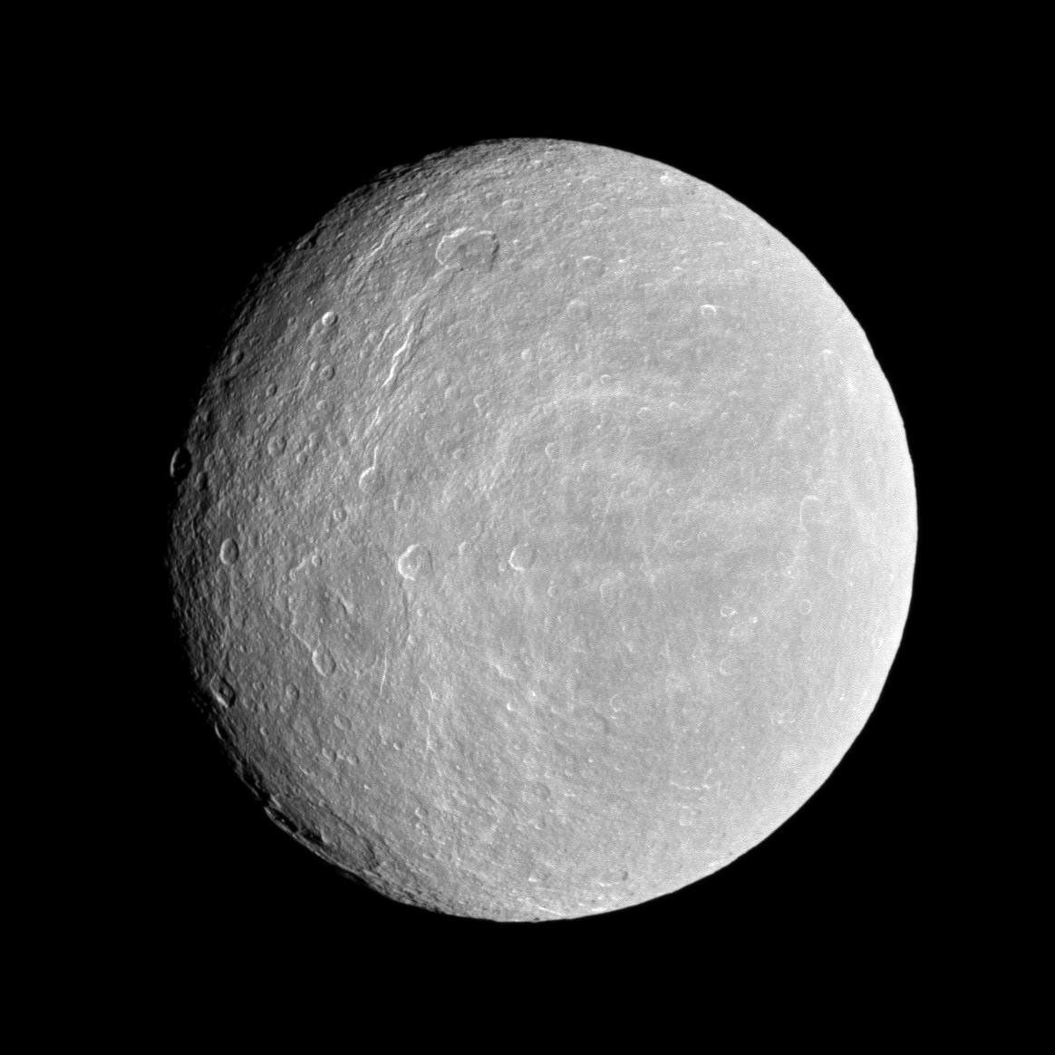 Rhea, a heavily cratered grey-white iceball