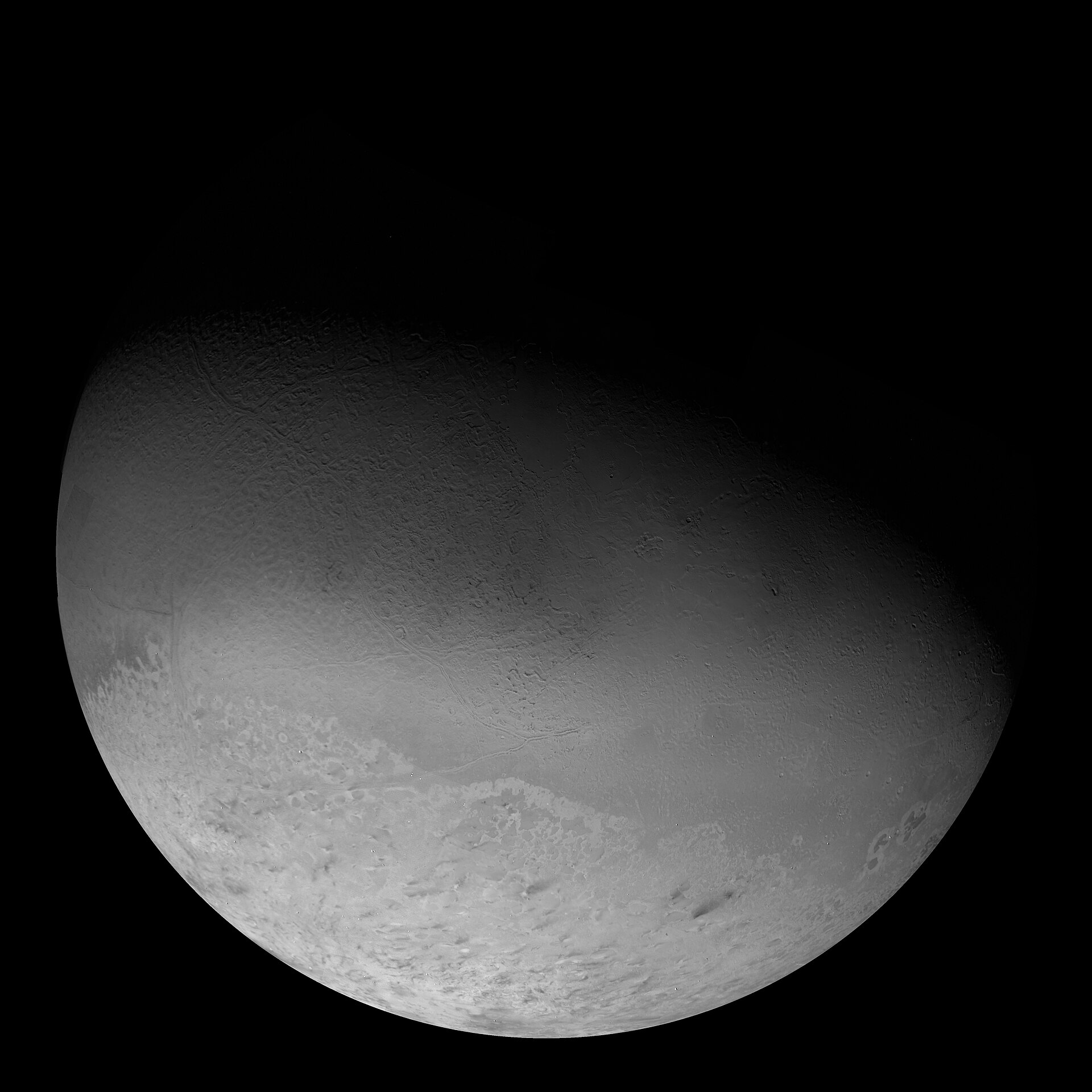 Triton: pale nitrogen ice, its southern cap dimpled like a cantaloupe