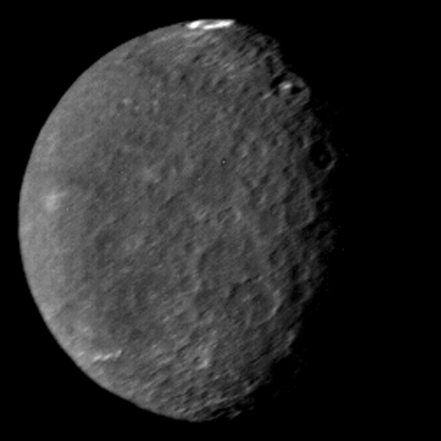 Umbriel, the darkest of Uranus’s moons, with one bright ring near its pole