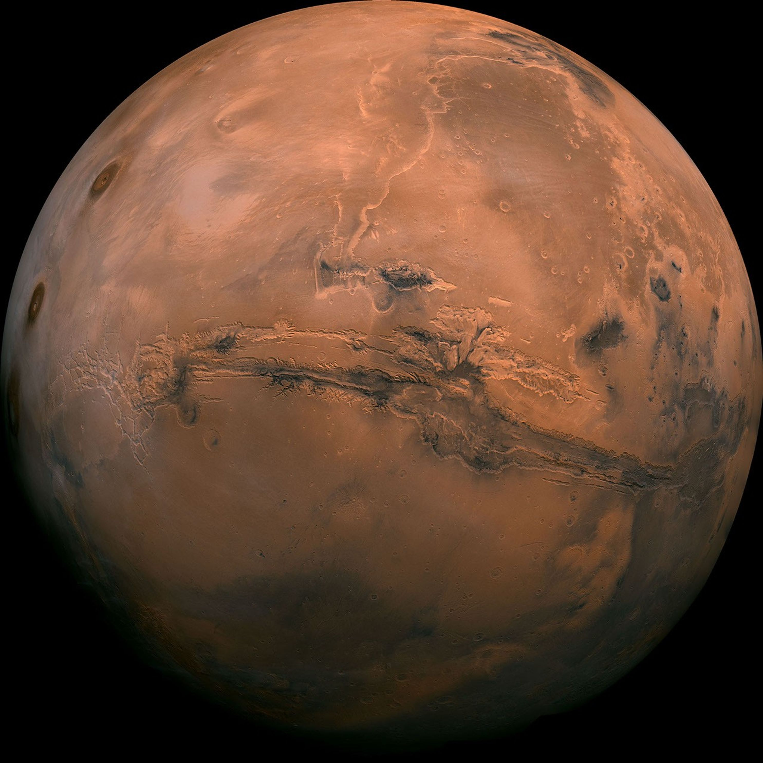 Mars as a full rust-coloured disc with Valles Marineris cutting across the centre